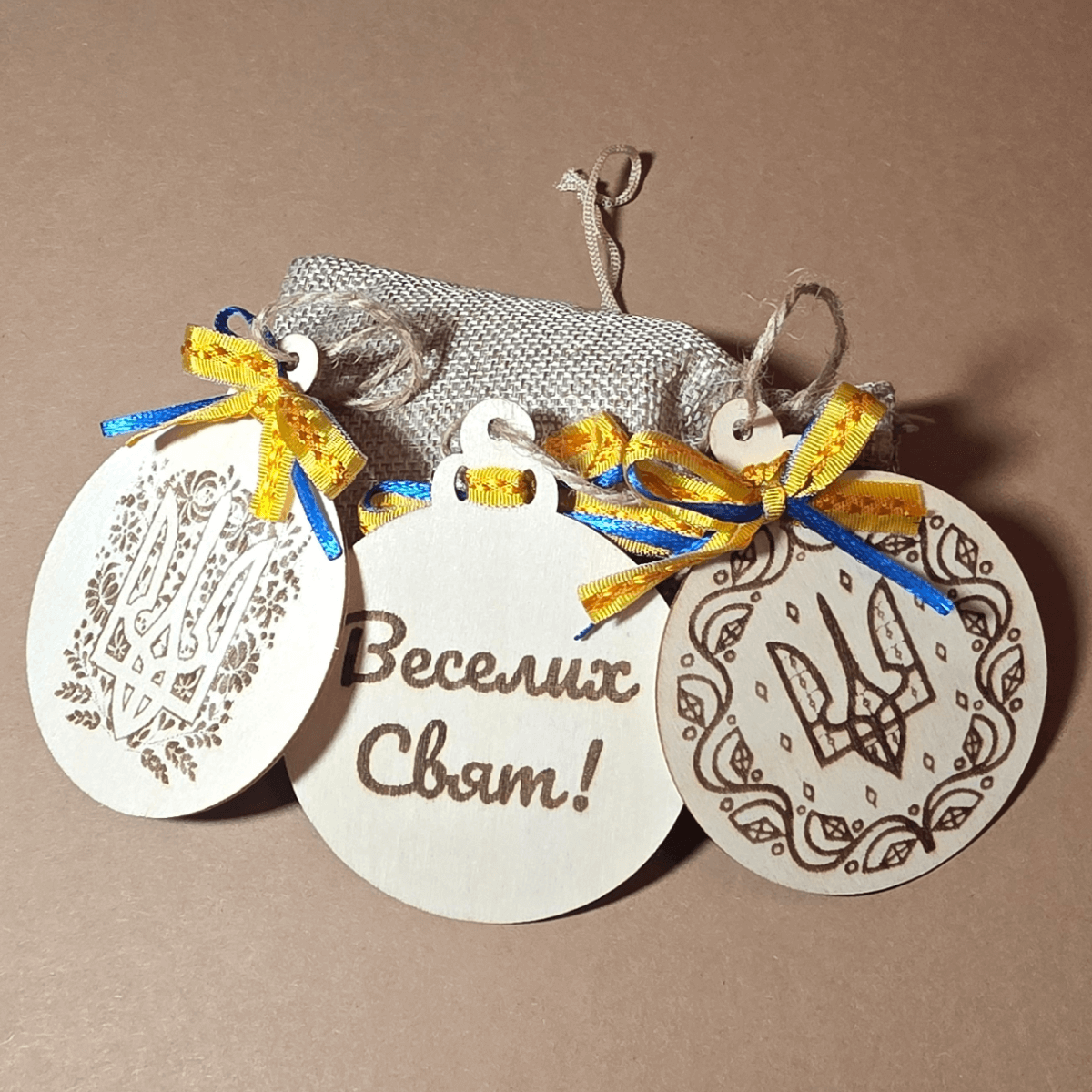 Ukrainian wooden ornaments with blue-yellow ribbons and gift pouch