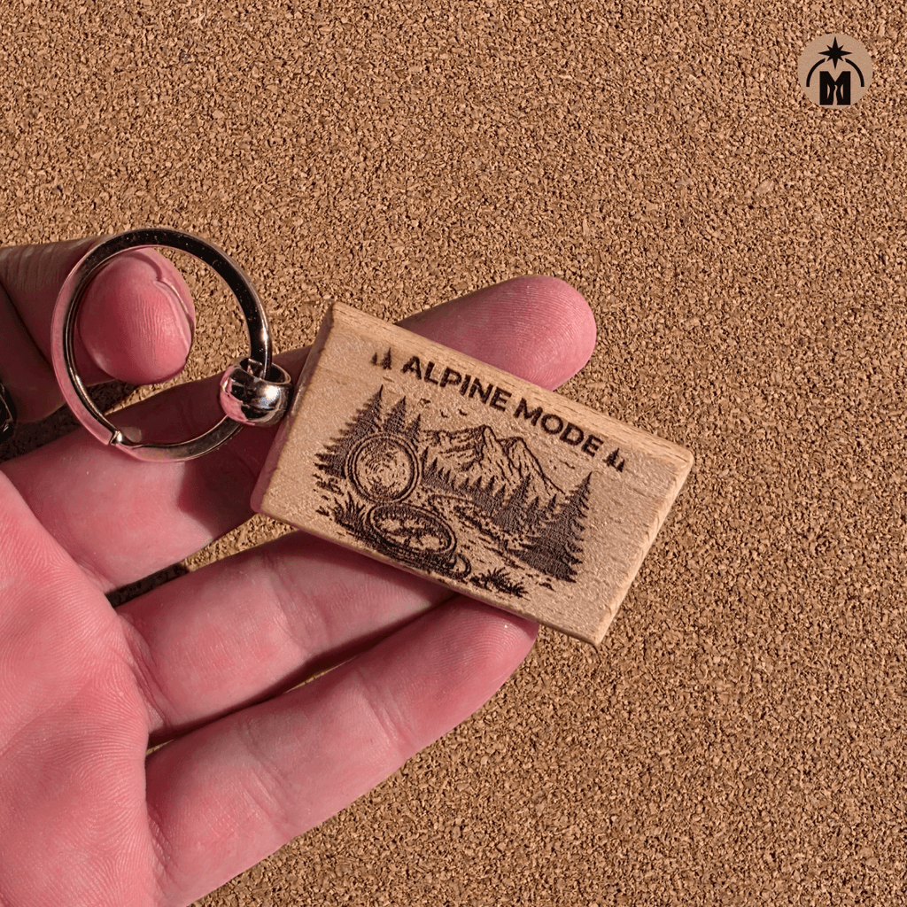 Laser engraved Alpine Mode wooden keychain with mountain and compass design