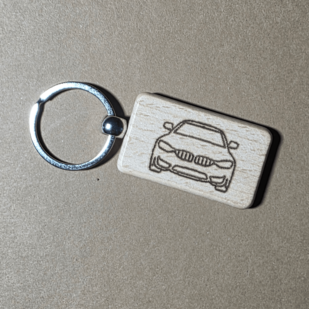 Laser engraved wooden keychain showing front view of E46 style car
