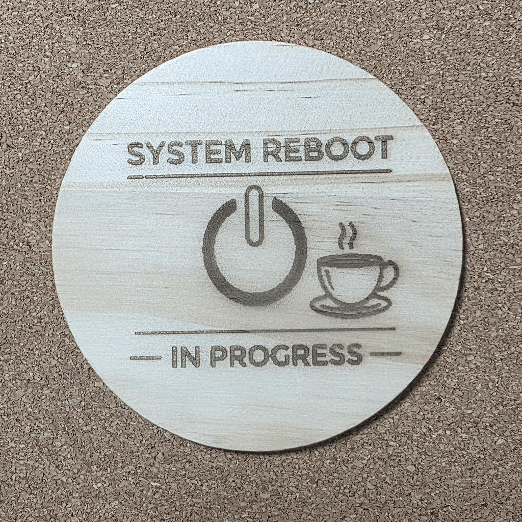 Funny coffee coaster ‘SYSTEM REBOOT / IN PROGRESS’ with power button icon, engraved wooden coaster