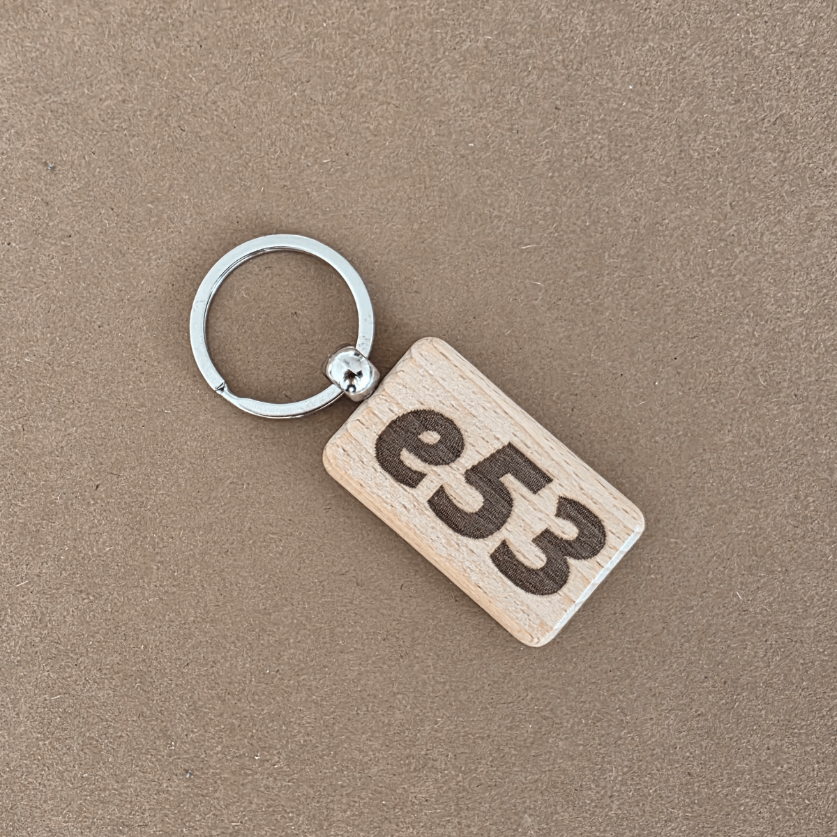 Beech wooden keychain with bold ‘e53’ engraving