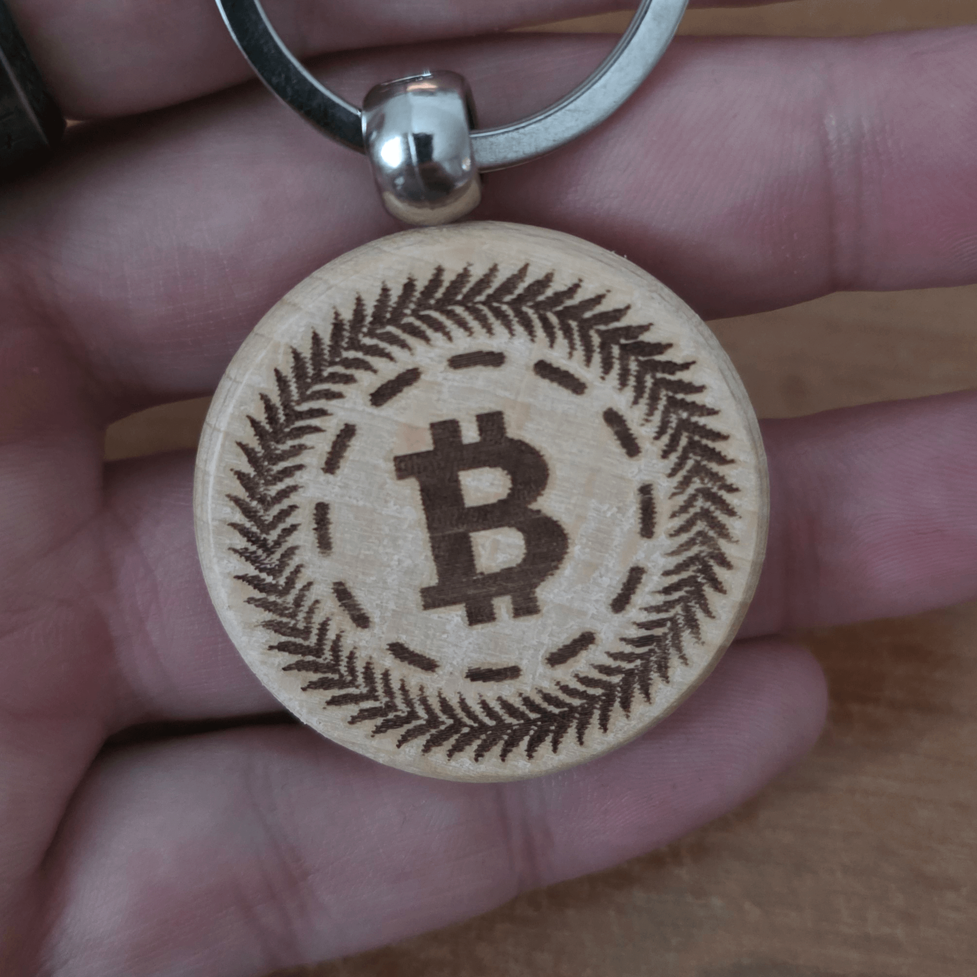 Close-up of monochrome engraving on wooden key ring