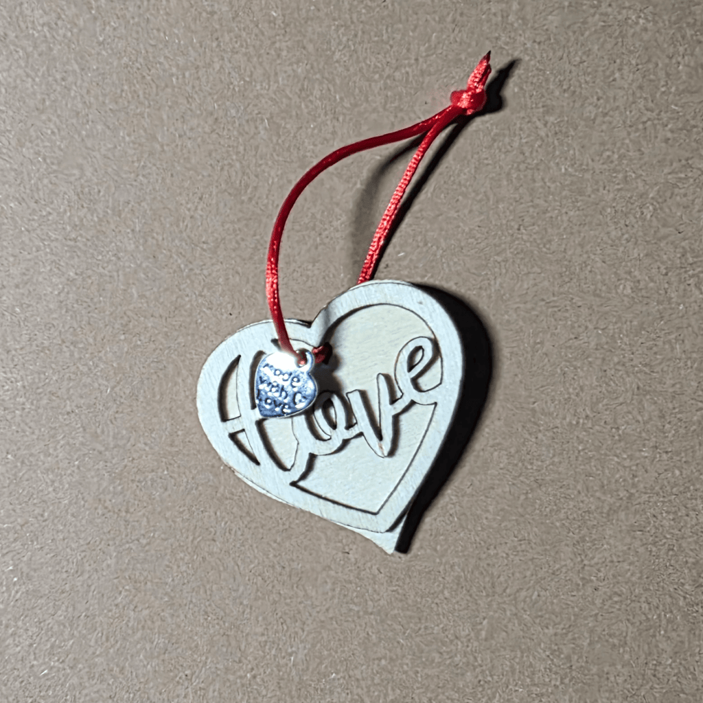 Layered wooden heart pendant on red cord with two mini heart charms