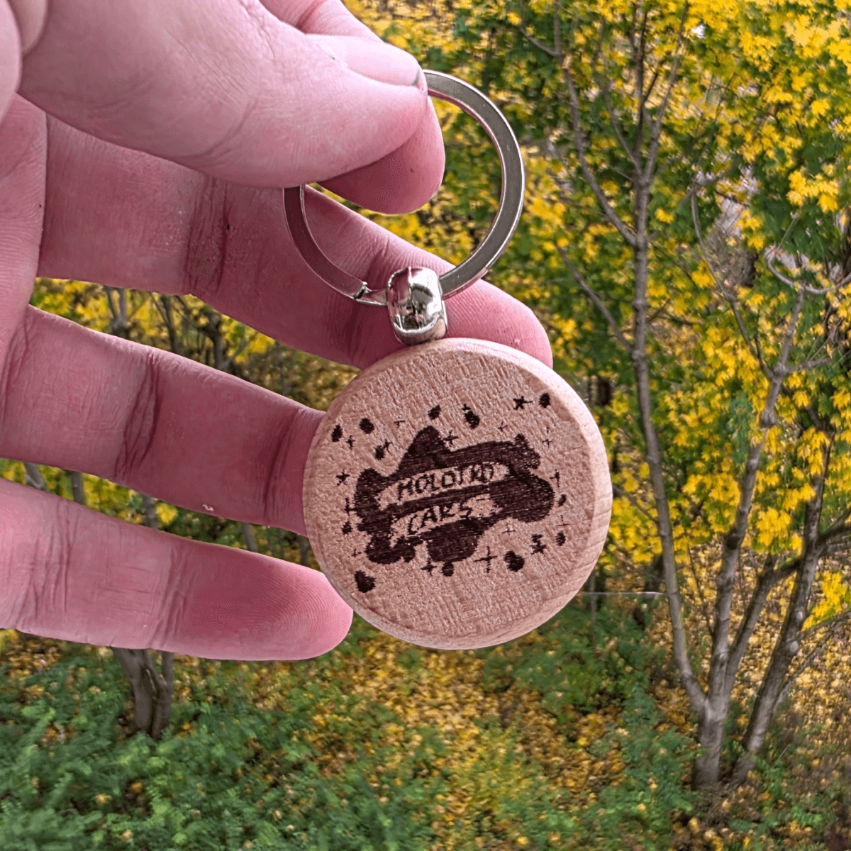 MolotkoCars logo engraved on round wooden keychain
