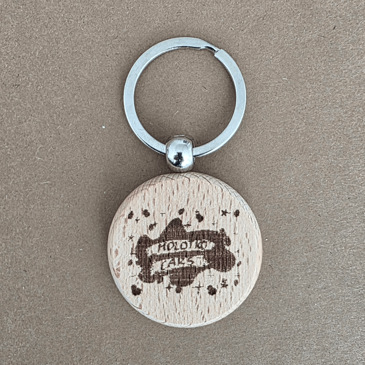 MolotkoCars logo engraved on round wooden keychain