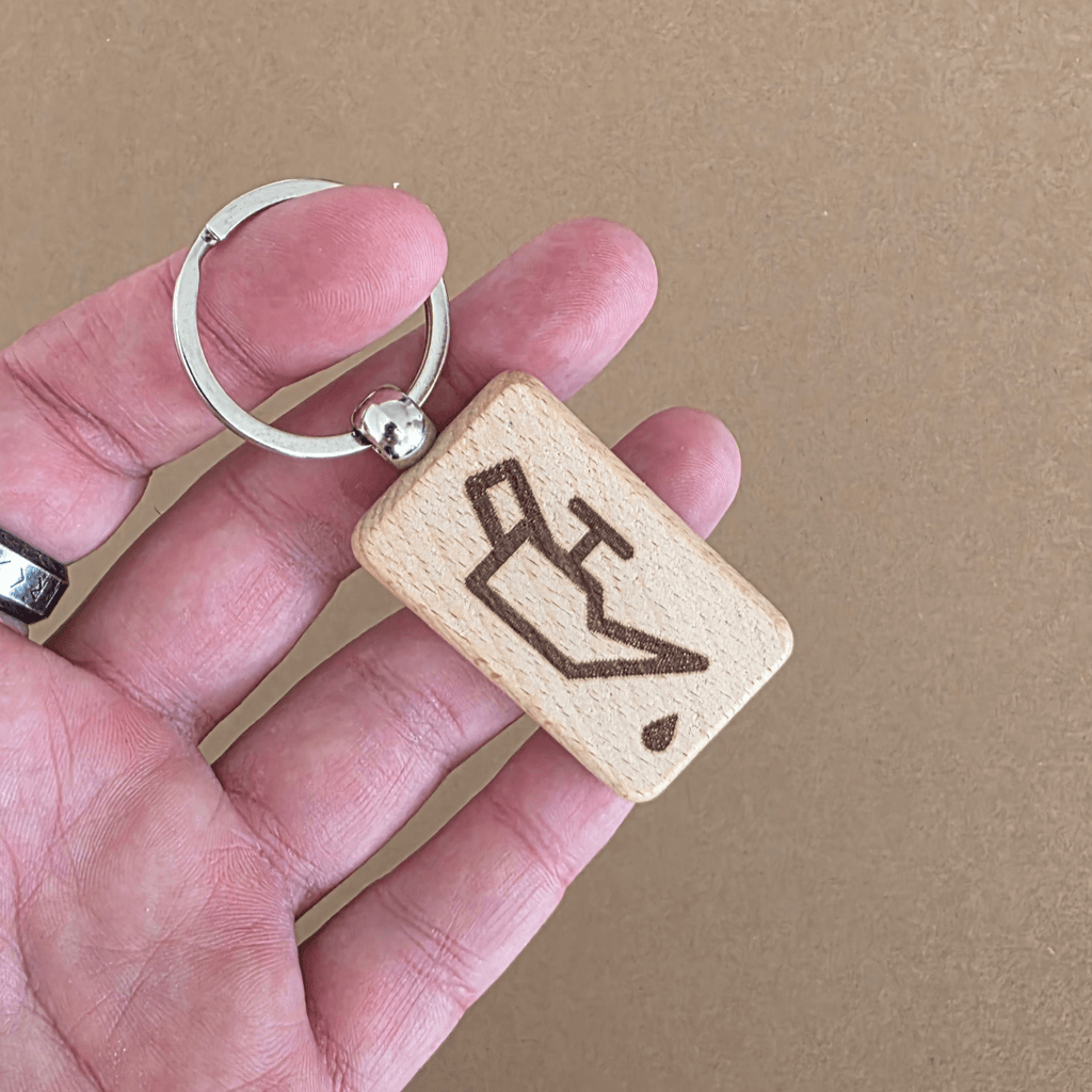 Wooden keychain with oil top-up icon — reverse side