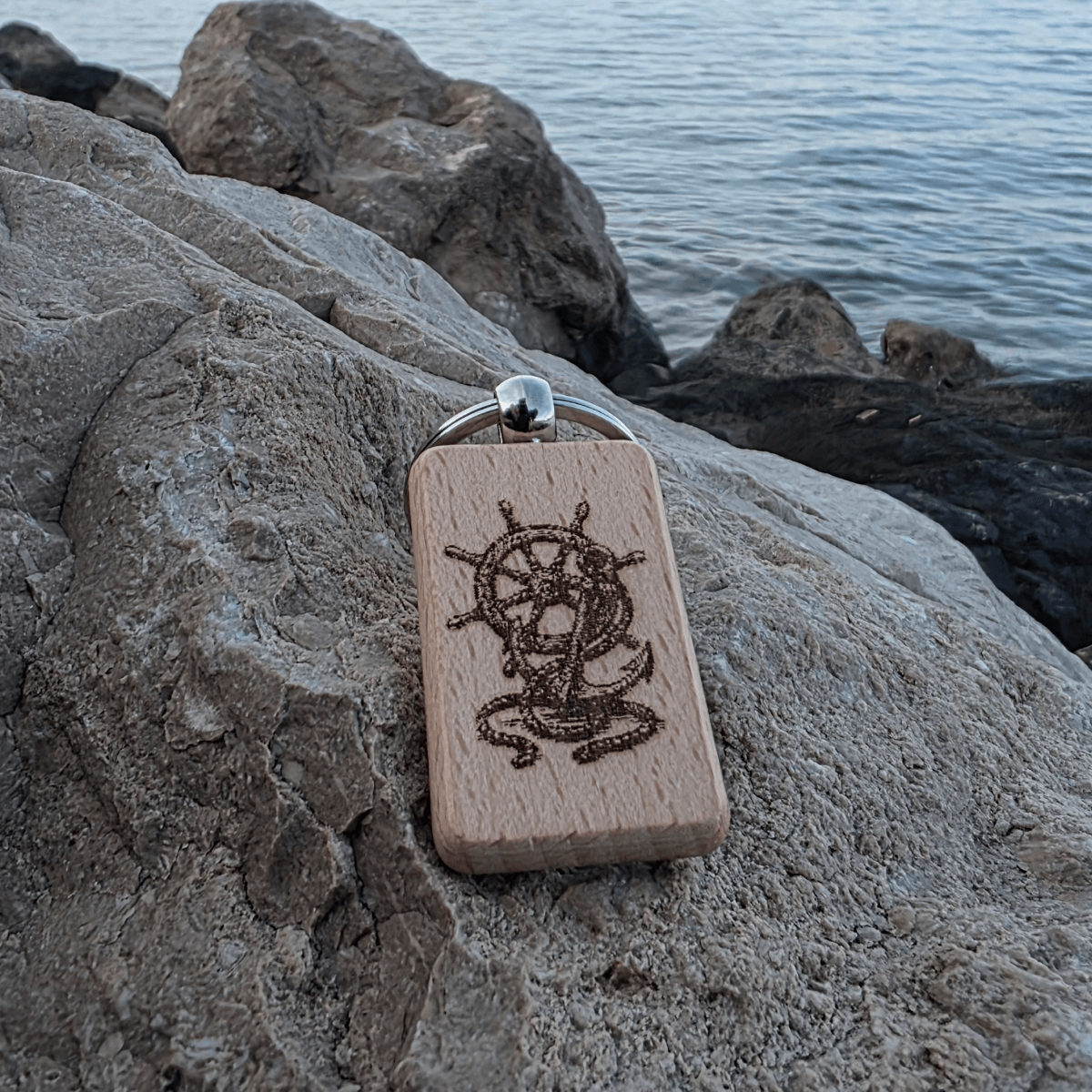 Close-up of ship’s wheel engraving detail on natural beech wood