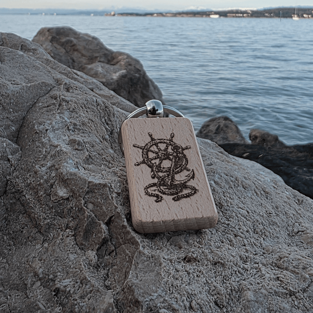 Front view of nautical helm & anchor laser engraving on beech key fob