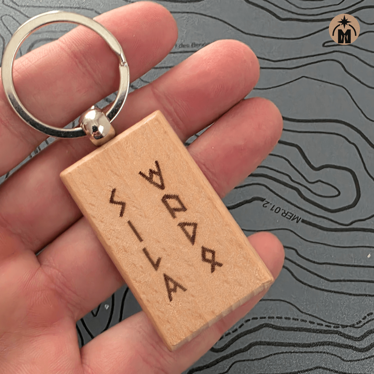 Beech wood rune keychain engraved “Power of Water” on a map background
