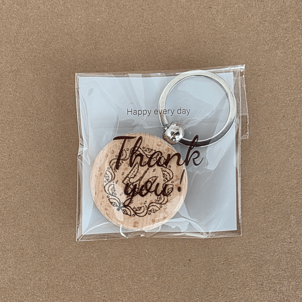 Doppelseitiger Schlüsselanhänger aus Holz mit ukrainischem Motto und Dreizack