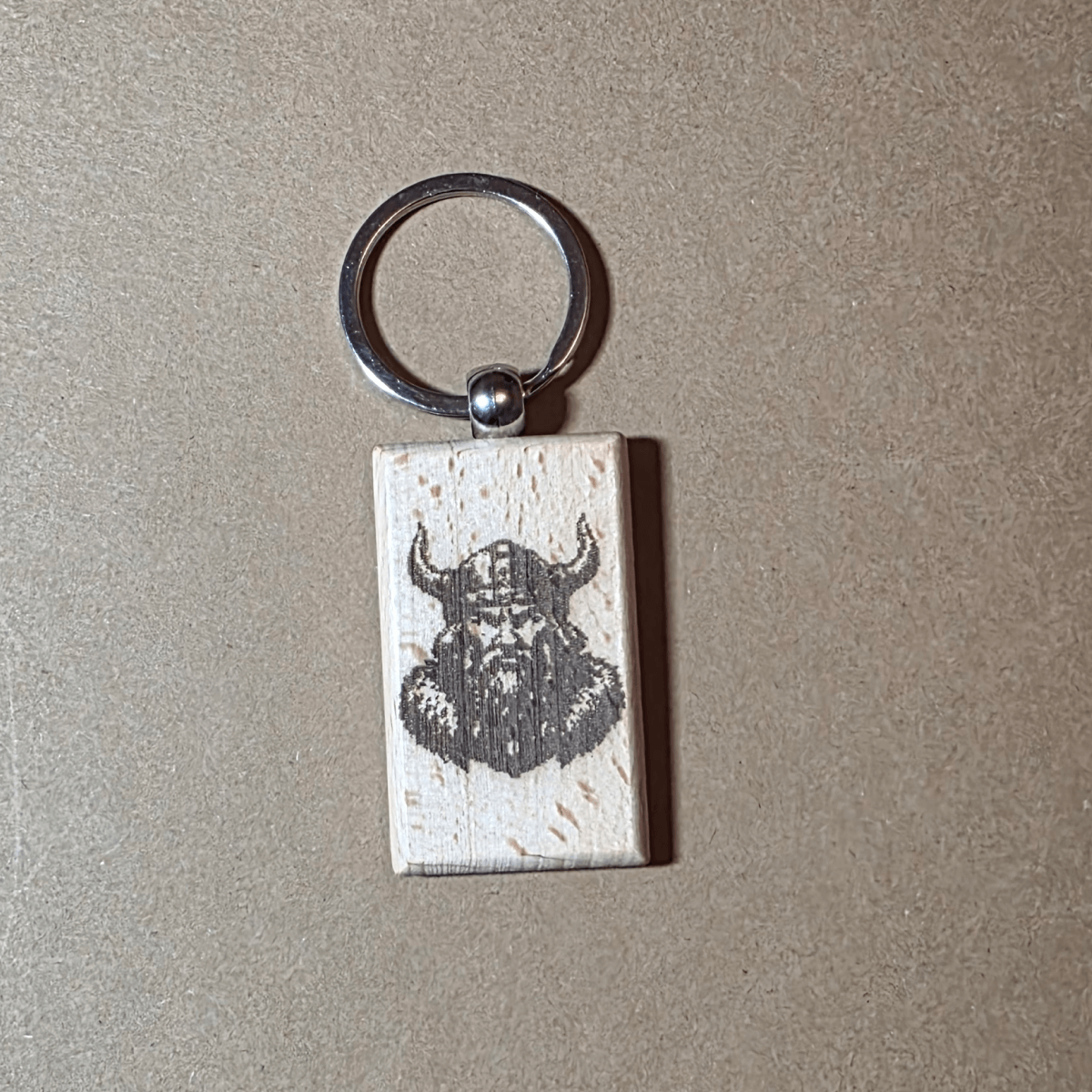 Laser engraved wooden keychain with Viking warrior head on natural beech wood