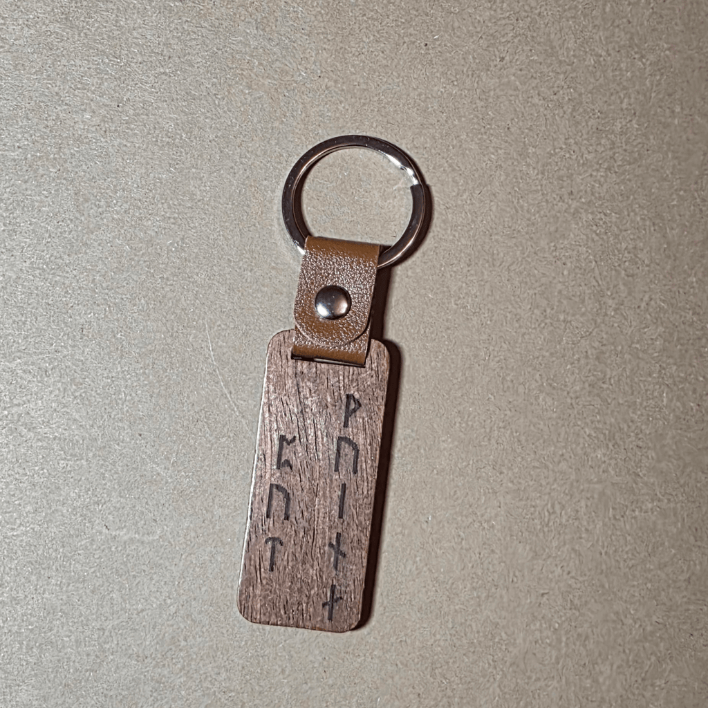 Dark wood Viking keychain with leather strap and runic inscription “Warrior’s Path”