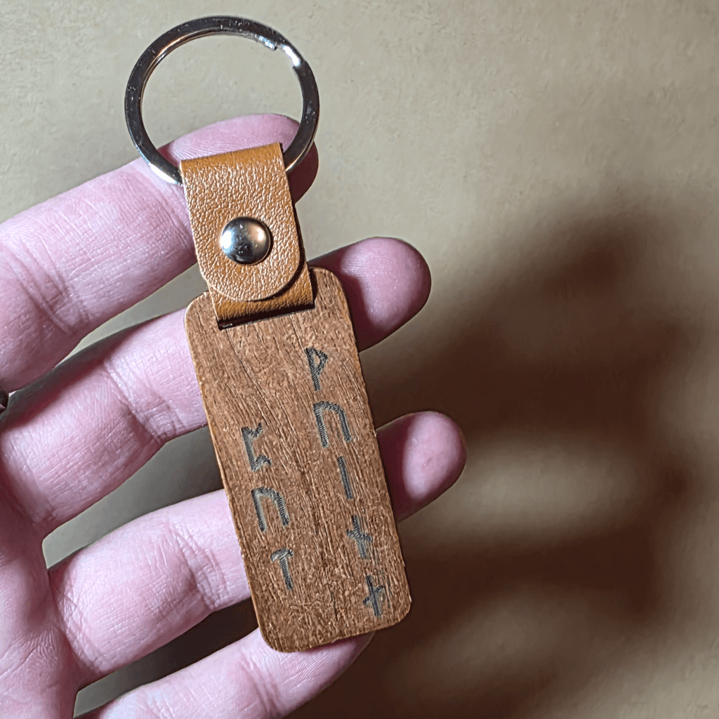 Engraved wooden keychain with Viking warrior and Nordic runes on leather ring