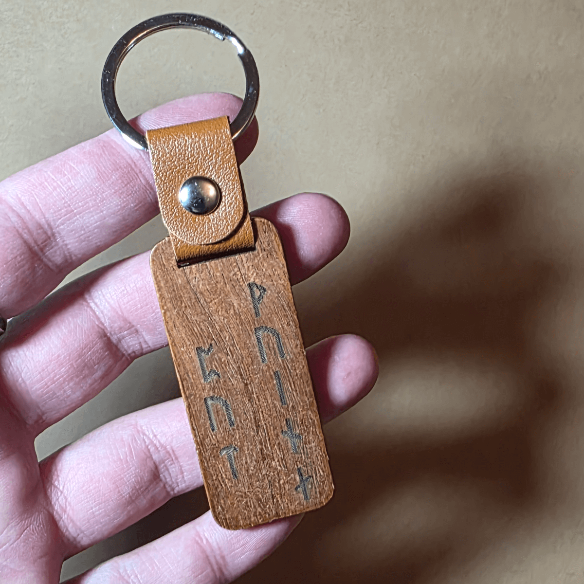 Engraved wooden keychain with Viking warrior and Nordic runes on leather ring
