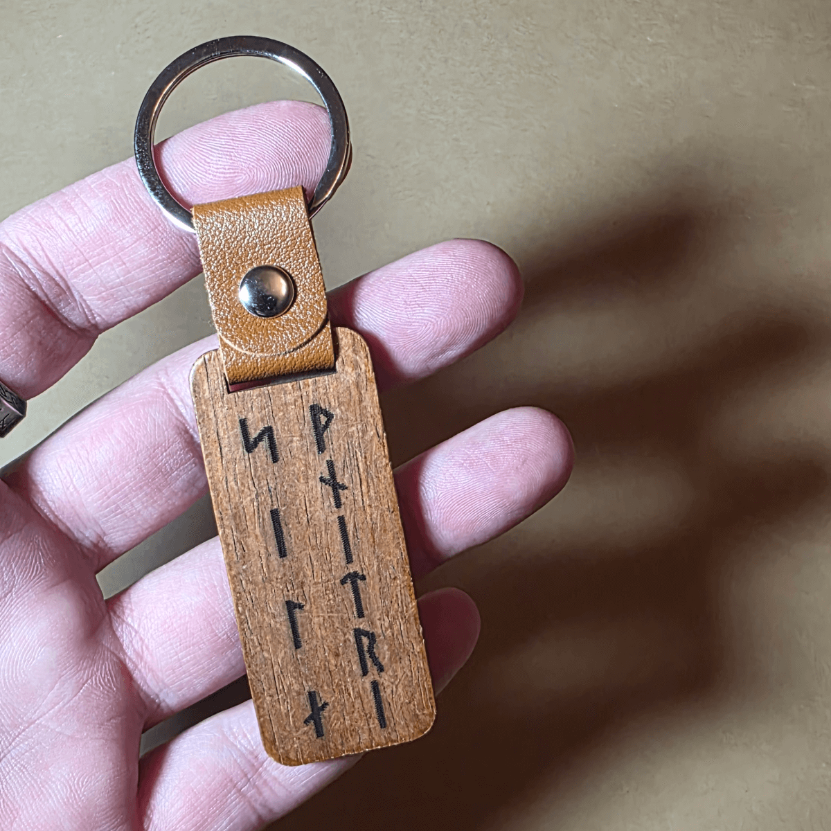 Double-sided Viking warrior wooden keychain with brown leather strap