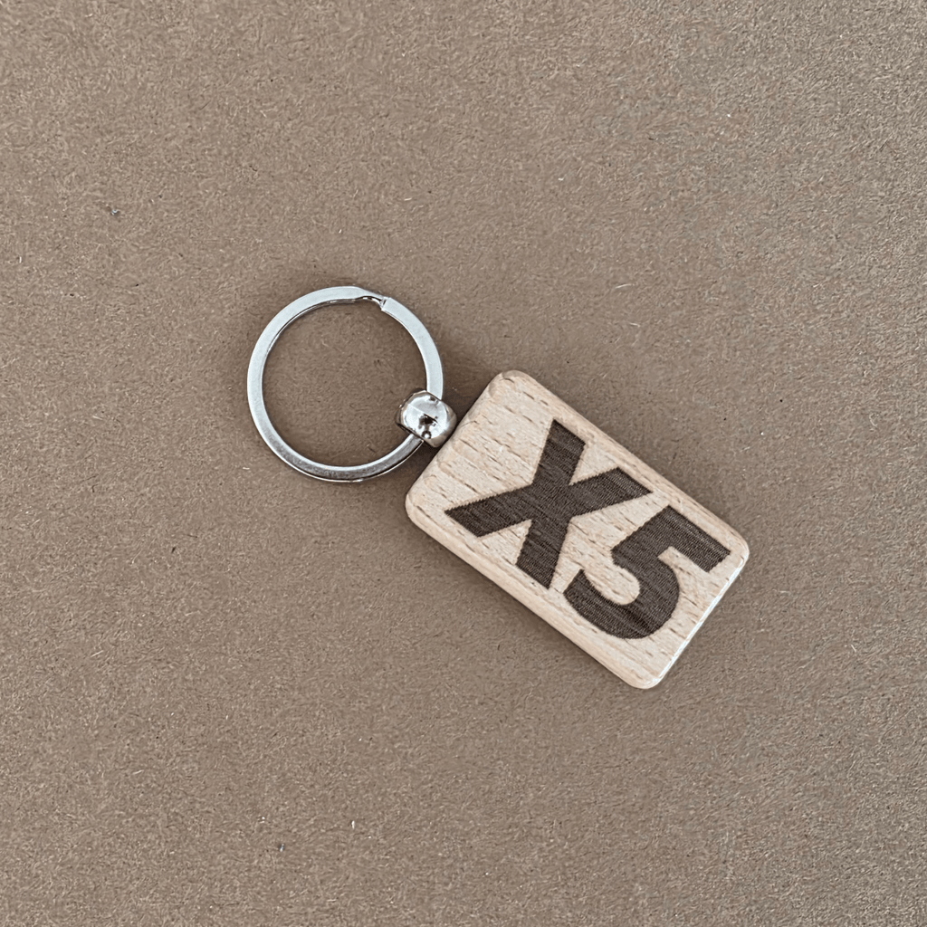 Wooden keychain with ‘X5’ engraving — reverse side
